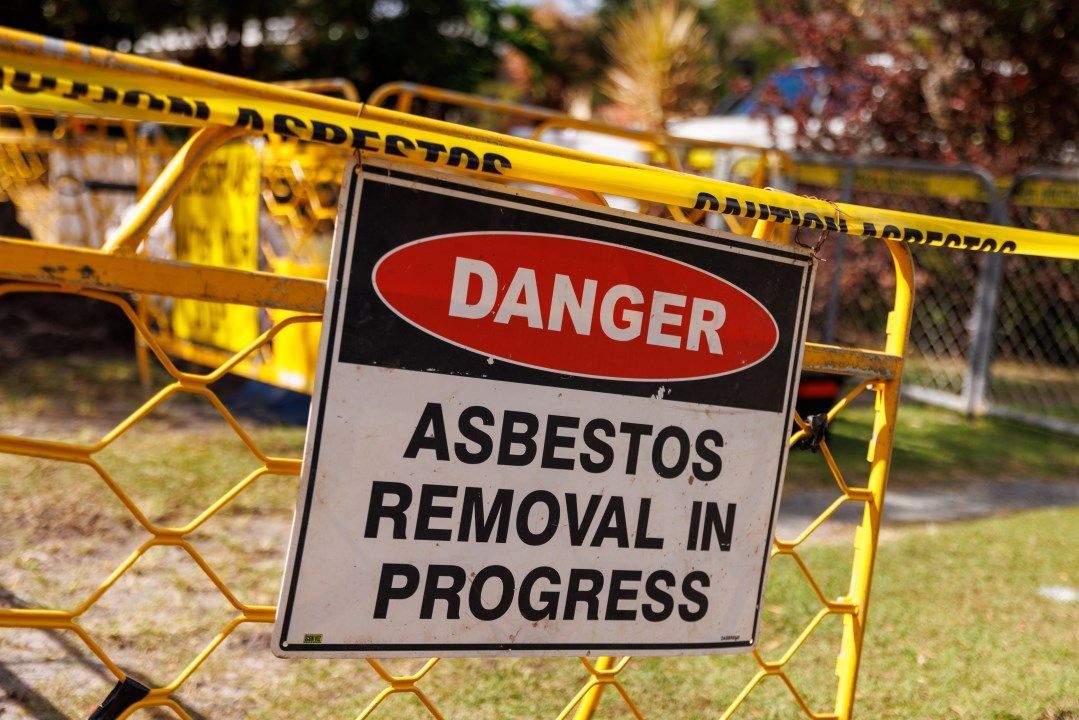 A Danger Sign That Says Asbestos Removal in Progress — Goat Collective in Tintenbar, NSW