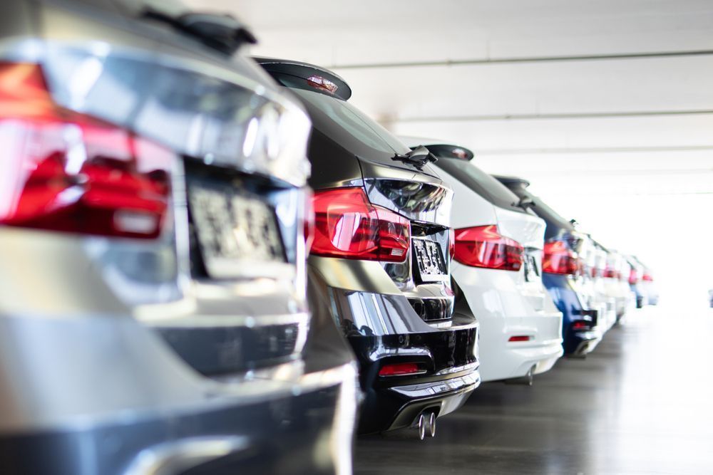 Row of Cars Parked in a Brightly Lit Garage — Albury Super Cheap Car Rentals in Lavington, NSW