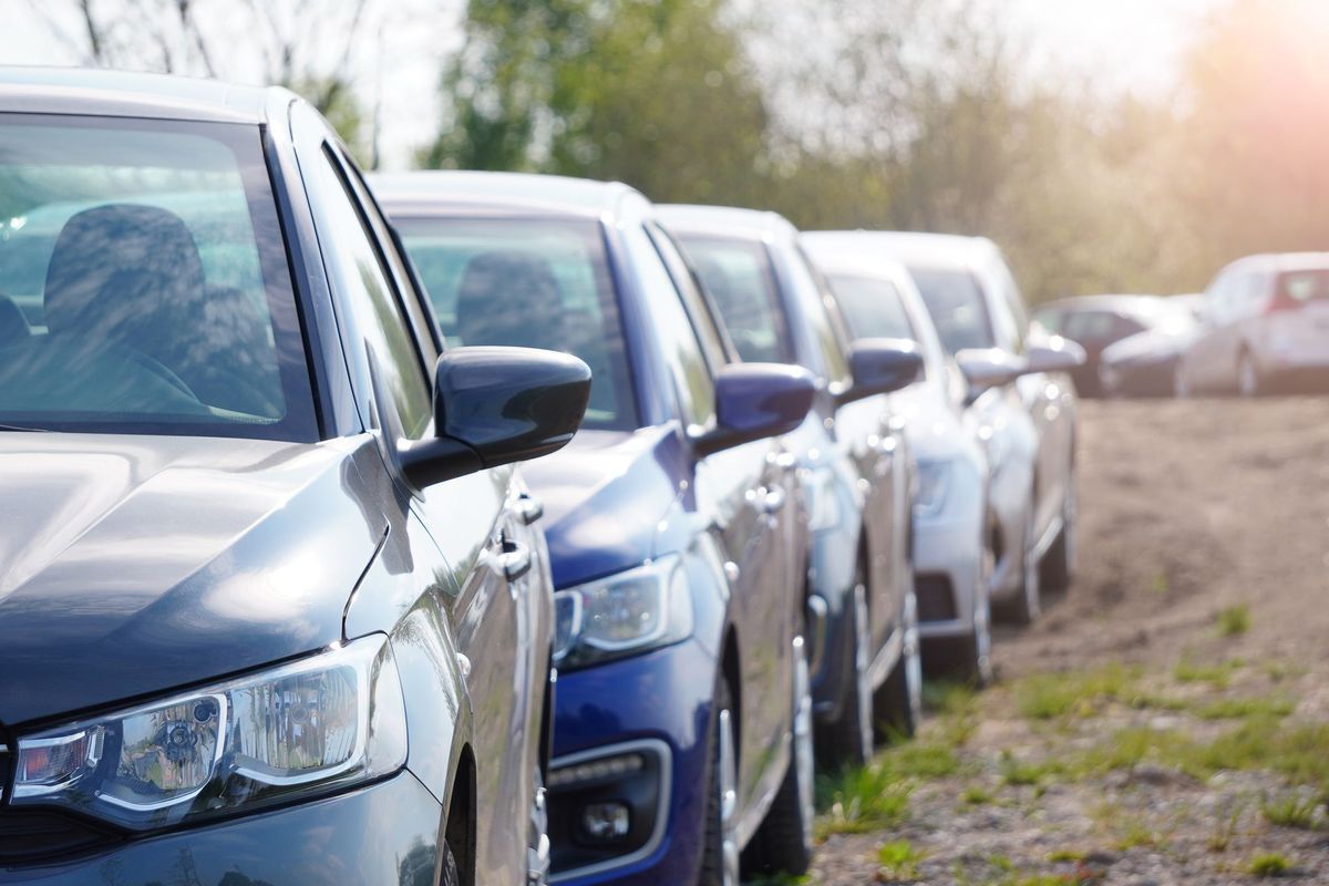 Row of Parked Cars, Various Colors, on a Sunny Day — Albury Super Cheap Car Rentals in Wodonga, NSW