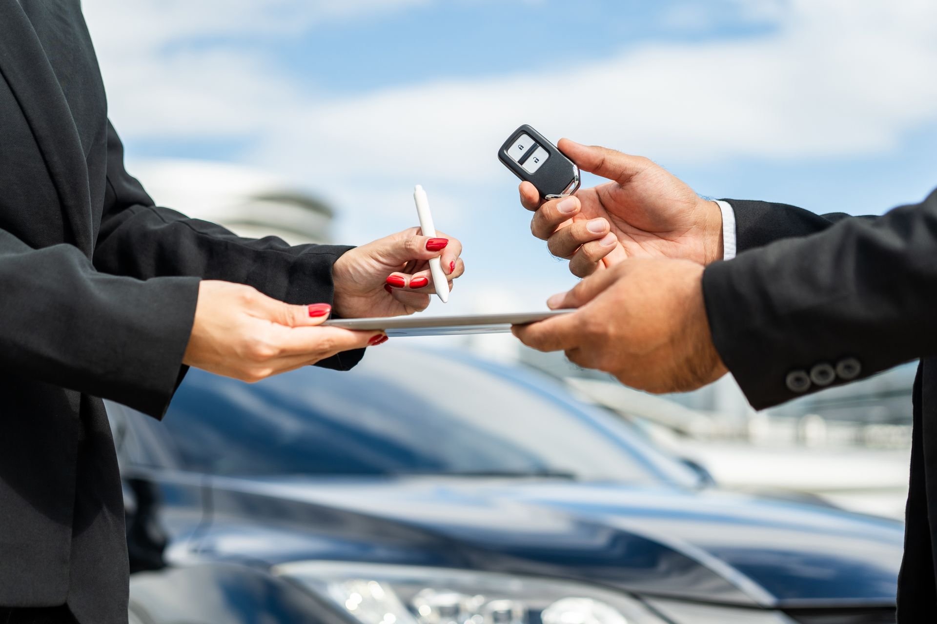 Person Handing Car Keys to Another Person — Albury Super Cheap Car Rentals in Lavington, NSW