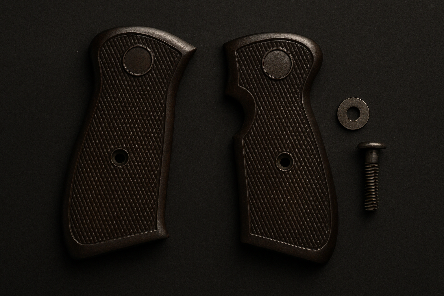Two dark-brown handgun grips, a washer, and screw on a black surface.