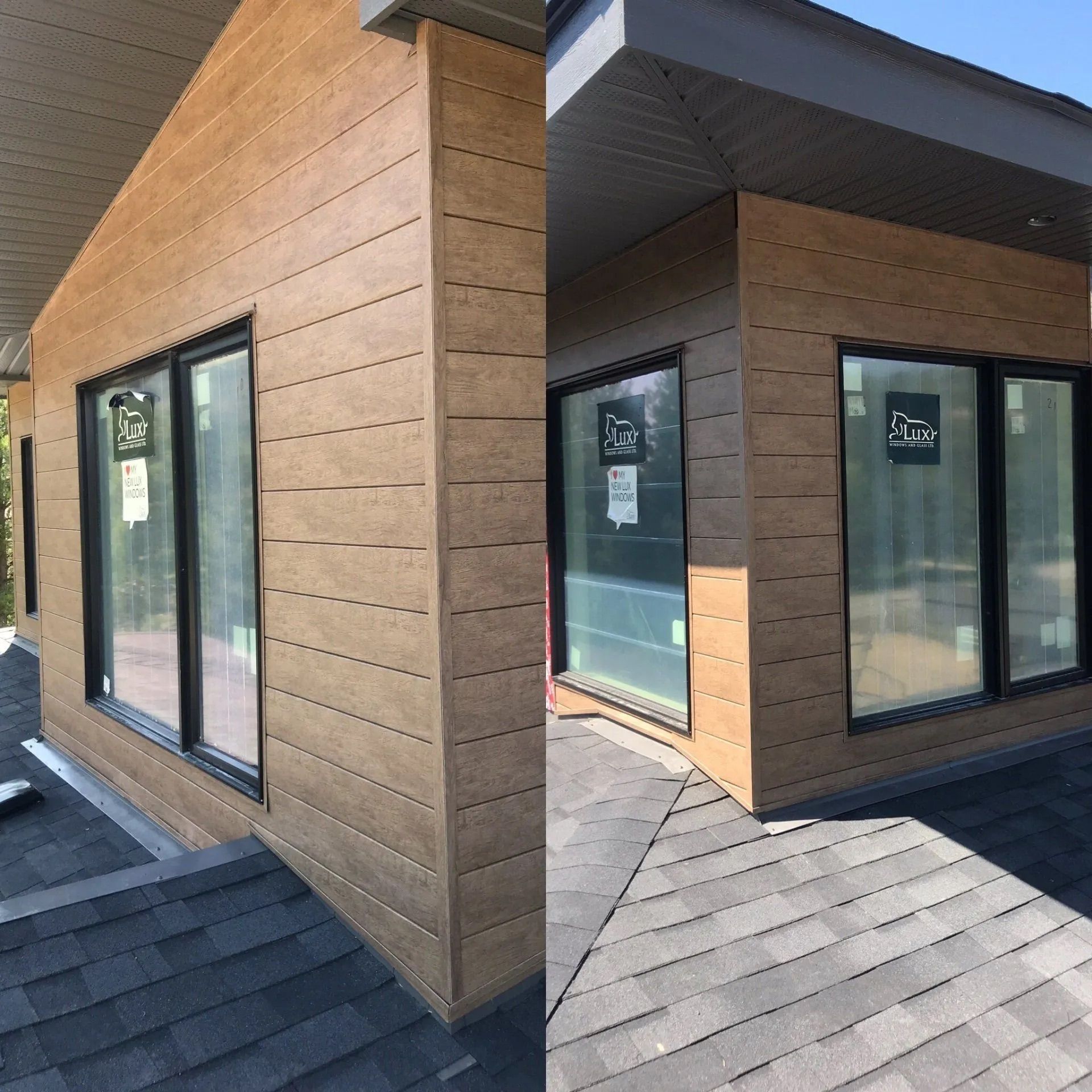 Modern wooden building exterior with large black-framed windows and gray shingled roof panels