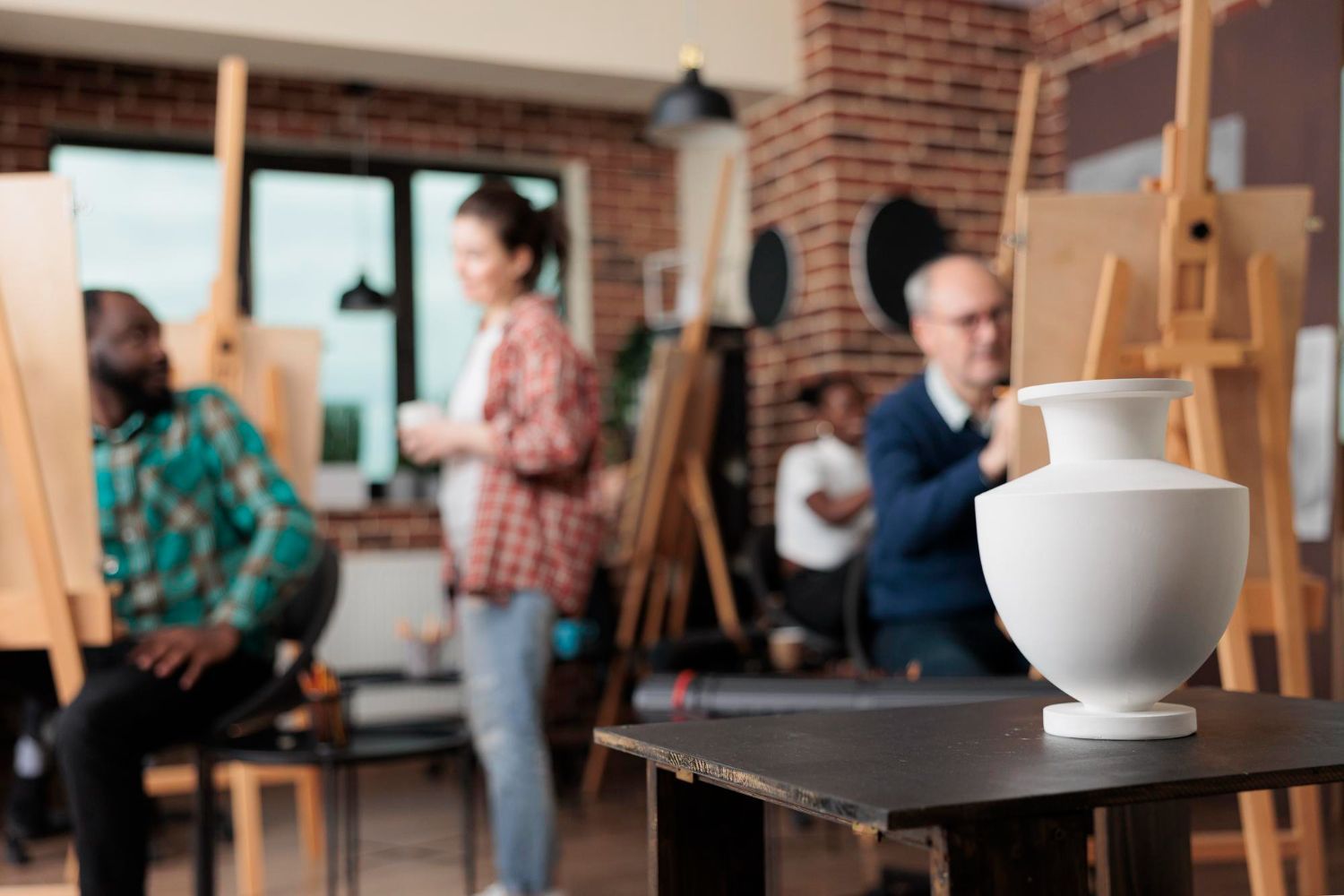 Man driving car, smiling, with family in the back seat.