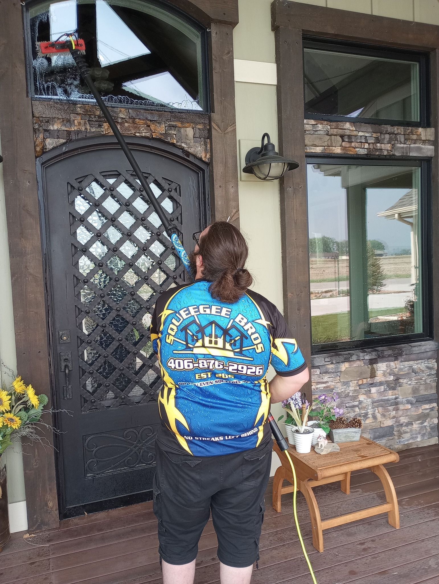 A man wearing a shirt that says ' excellence ' on it