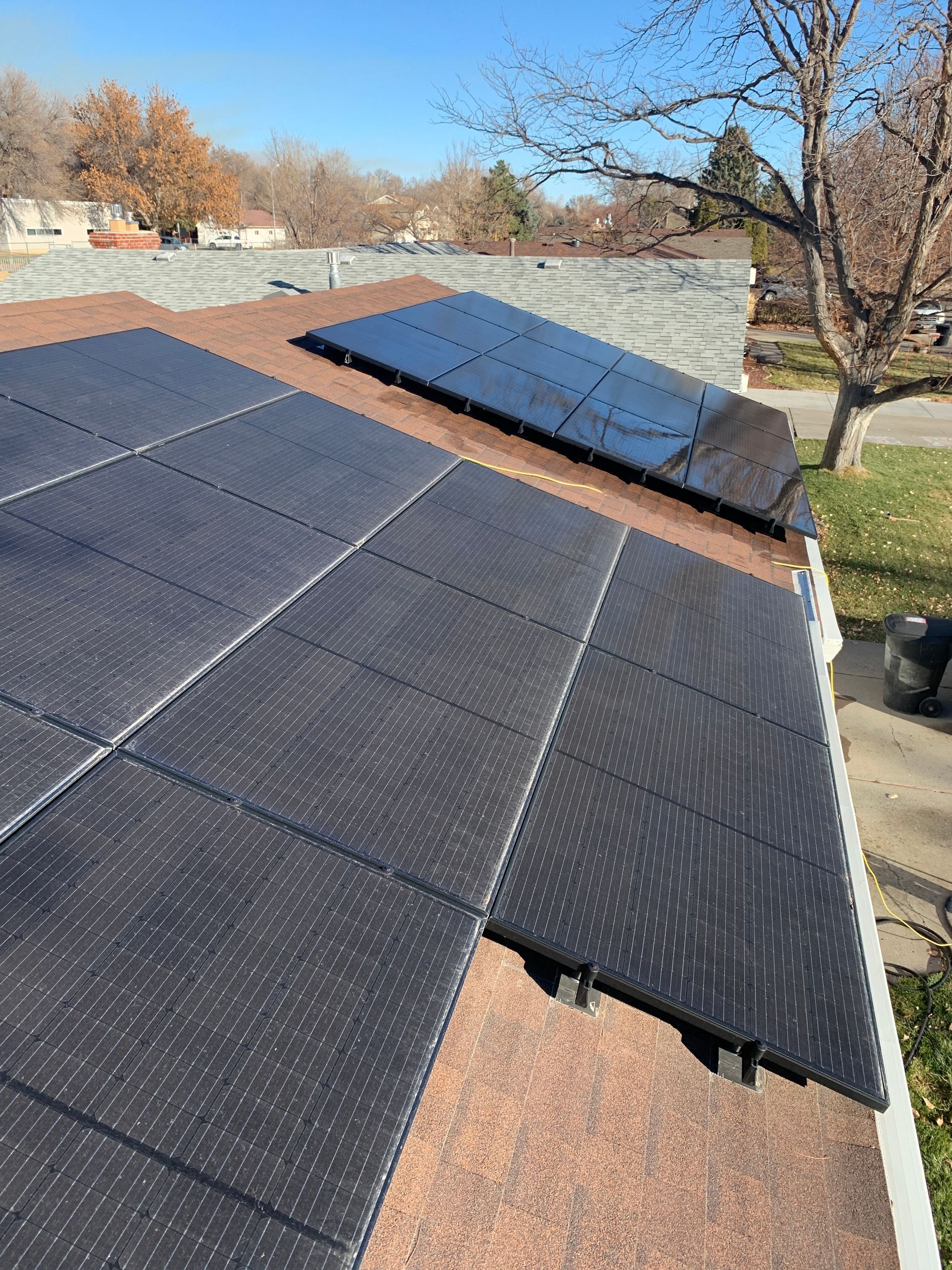A roof with a lot of solar panels on it