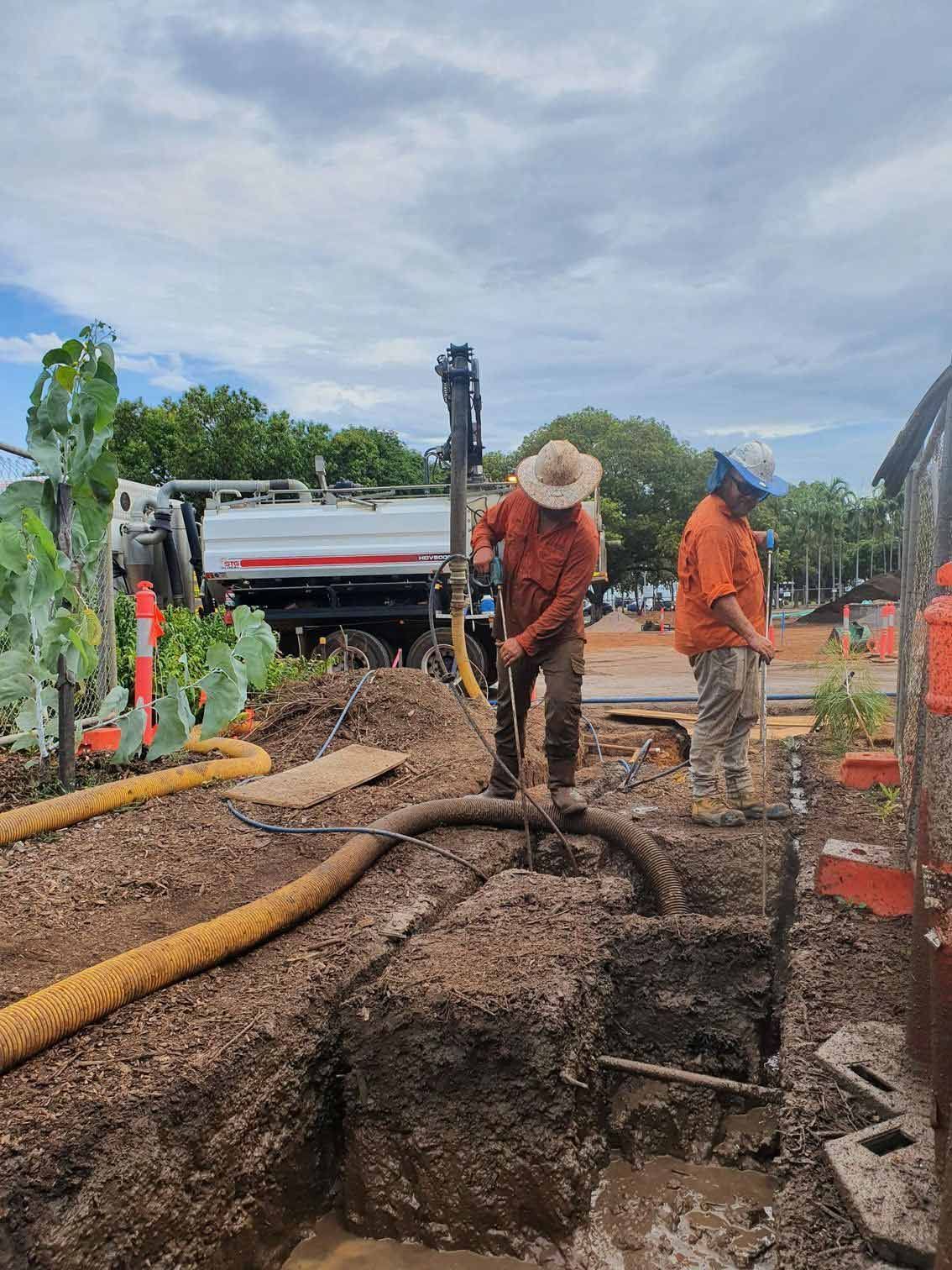 Worker installing pipe — Underground Service Locator in Gunn NT
