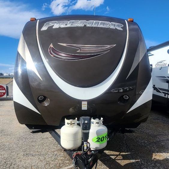 A brown and white trailer with the word premier on it