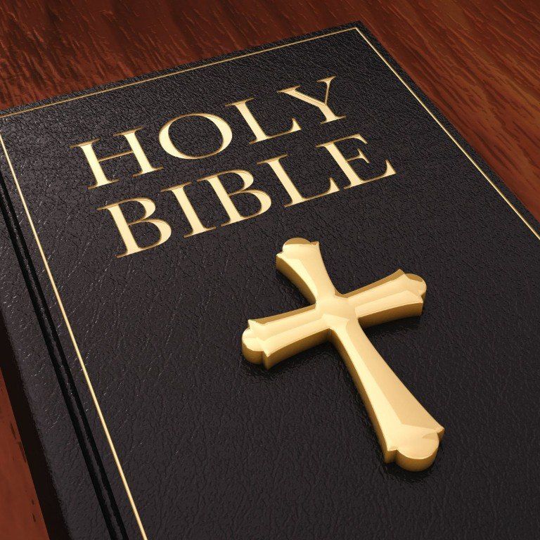 The Holy Bible with a cross