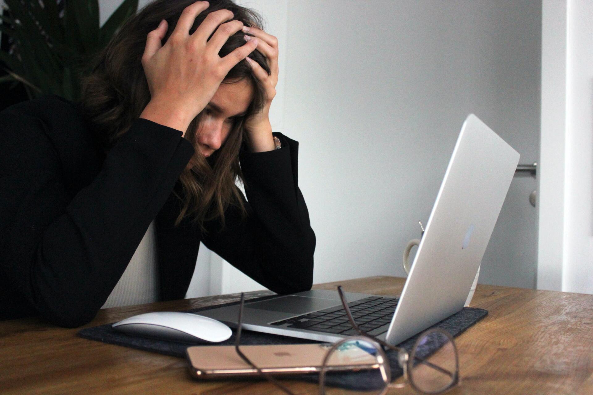 frustrated woman at laptop computer
