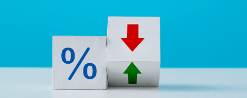 one cube with a blue percent (%) sign and one cube with a red arrow pointing down and a green arrow pointing up.