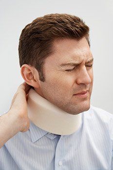 Man wearing neck braces — The Law Office of Kelly Mulligan in Bel Air, MD