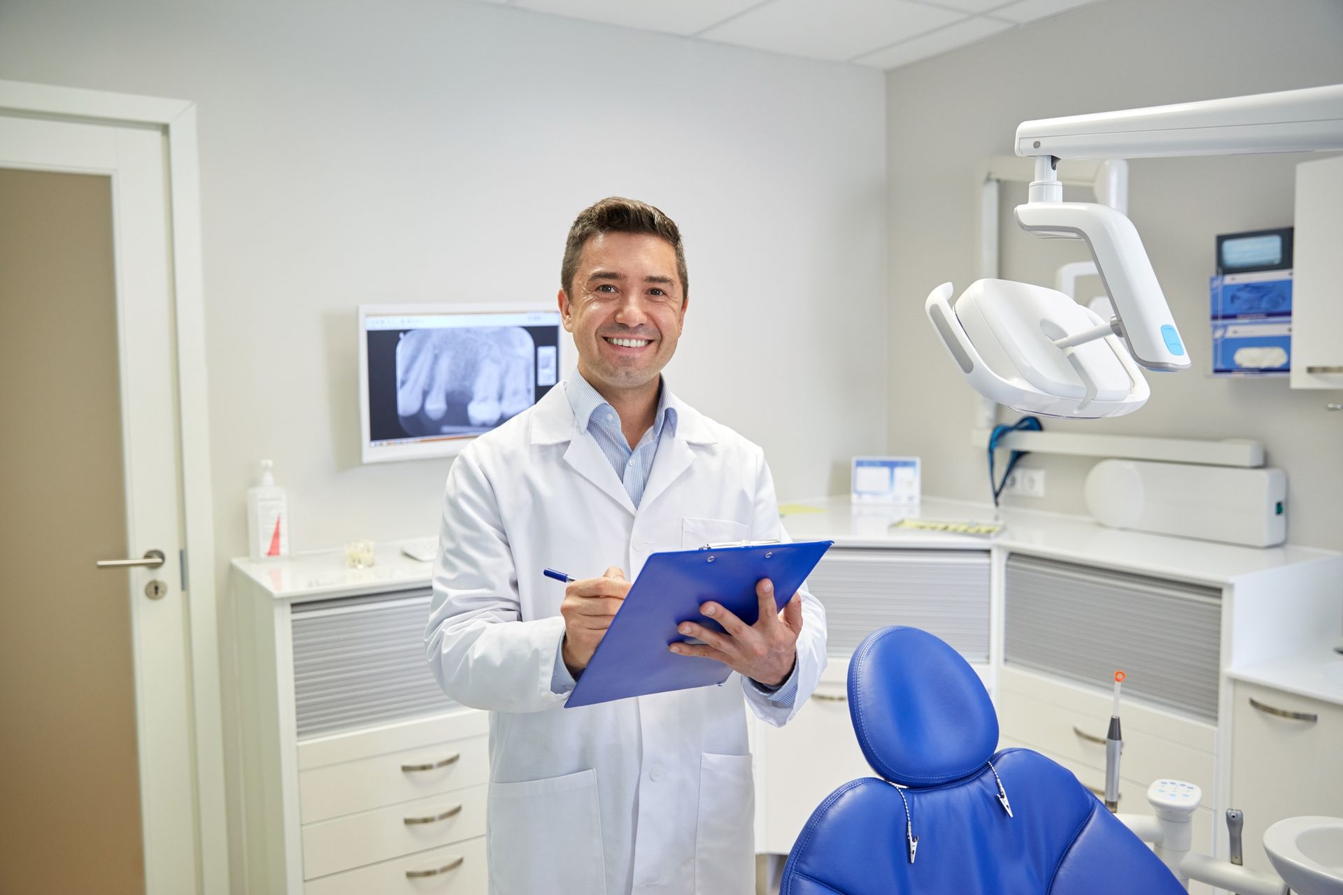 dentist smiling during a dental consultation at a dentist office