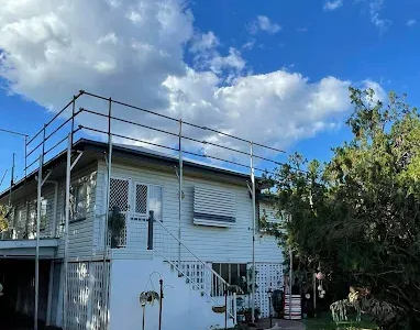 Gray Corrugated Metal Roof With a Television Antenna and Vent — Hales Plumbing & Roofing In The Range, QLD