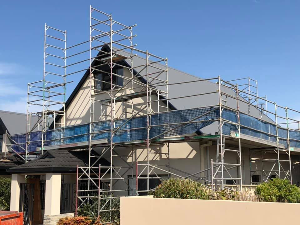 A House Roof Is Being Built With Scaffolding Around It — Residential Roofs in Toowoomba, QLD