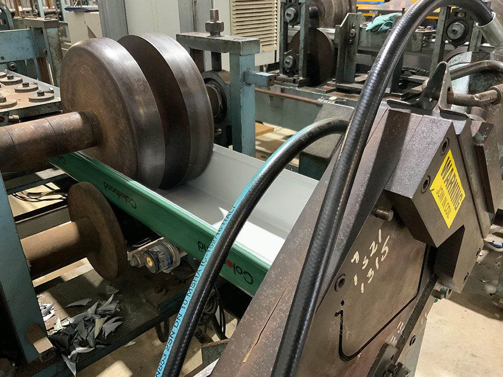 A Machine Is Installed On A Table In A Factory — Commercial Roofs in Toowoomba, QLD