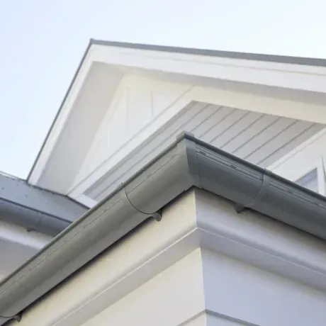 A Roof Is Being Installed On A Brick Building — Roof Flashings in Toowoomba, QLD