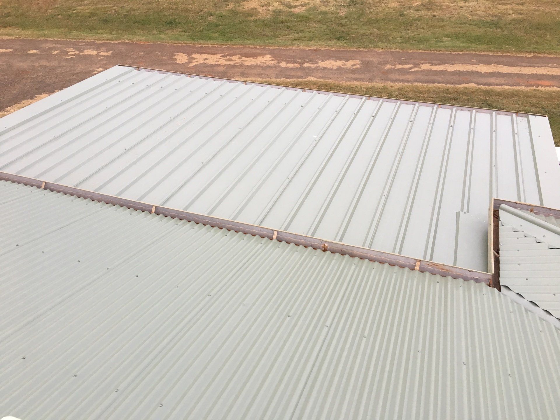 Insulated metal re-roof roof replacement