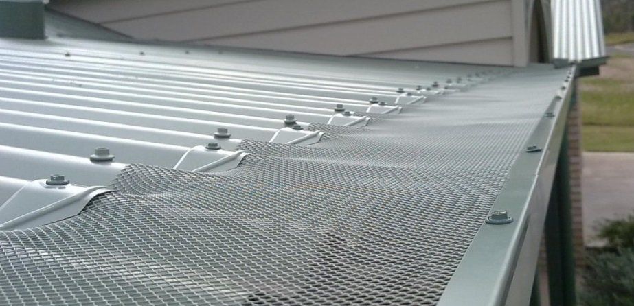 Gutter leaf guard mesh installed to corrugated sheeting