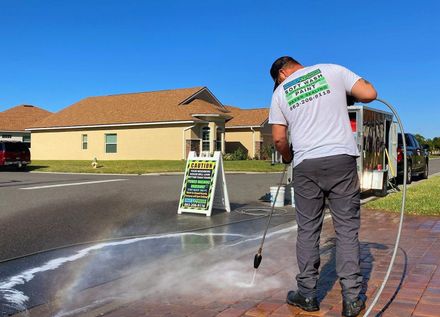 Close up showing driveway sealant to protect the bricks. Sealcoating background for new home construction.