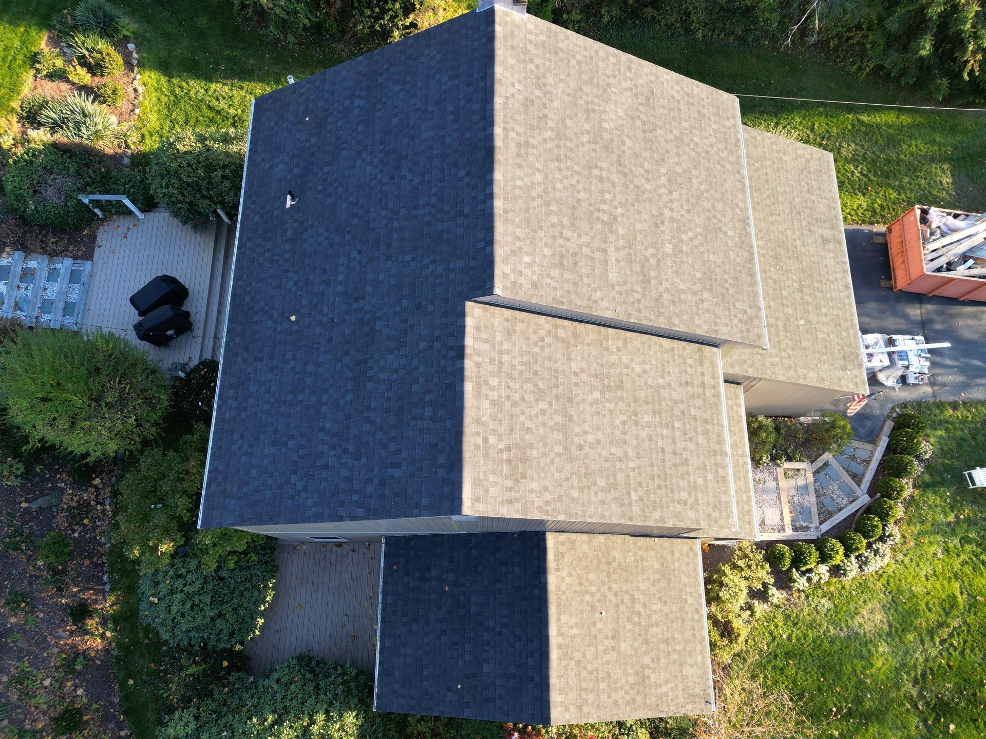 An aerial view of a house with a large roof