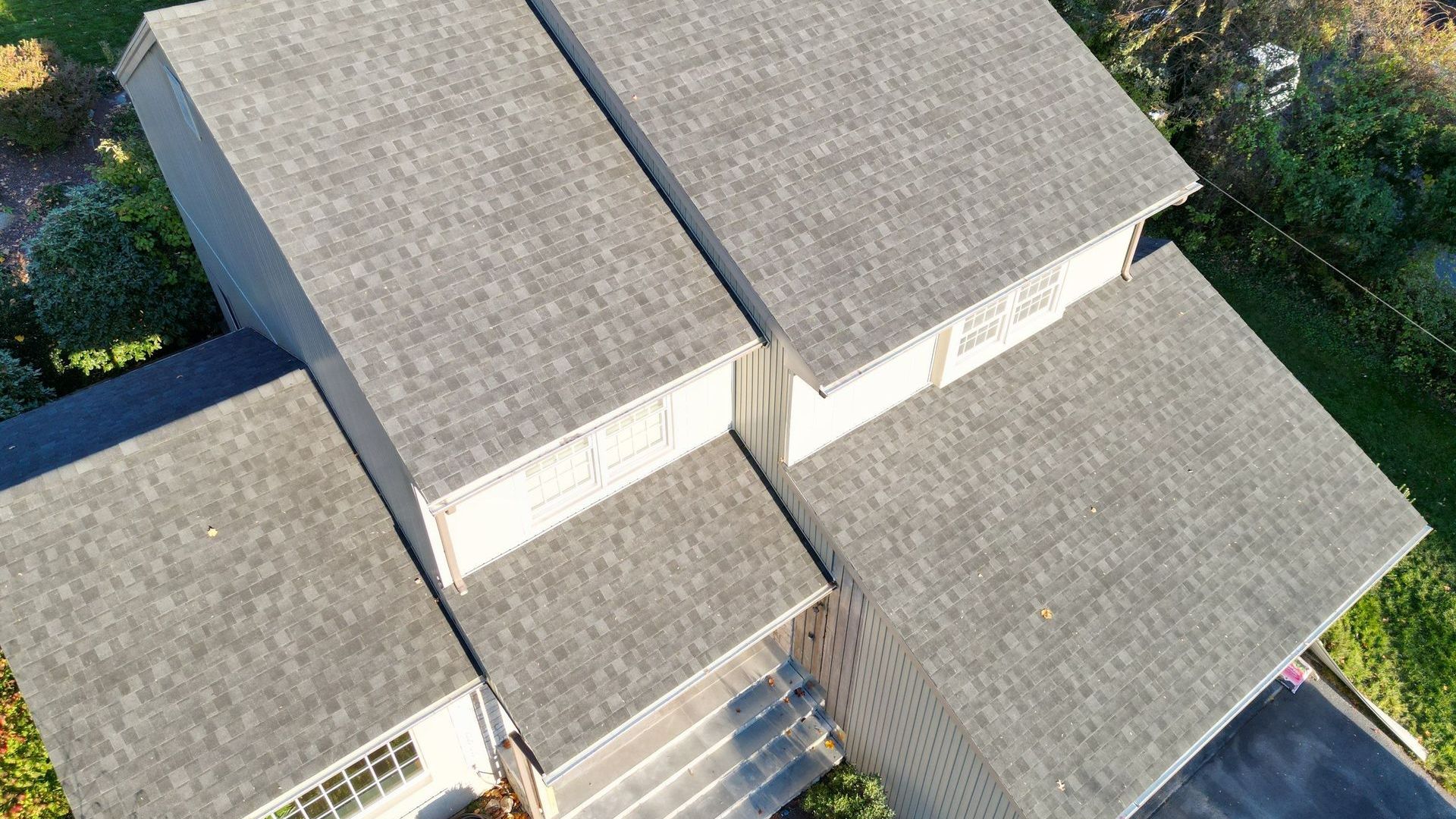 A close up of the side of a house with a light on it.
