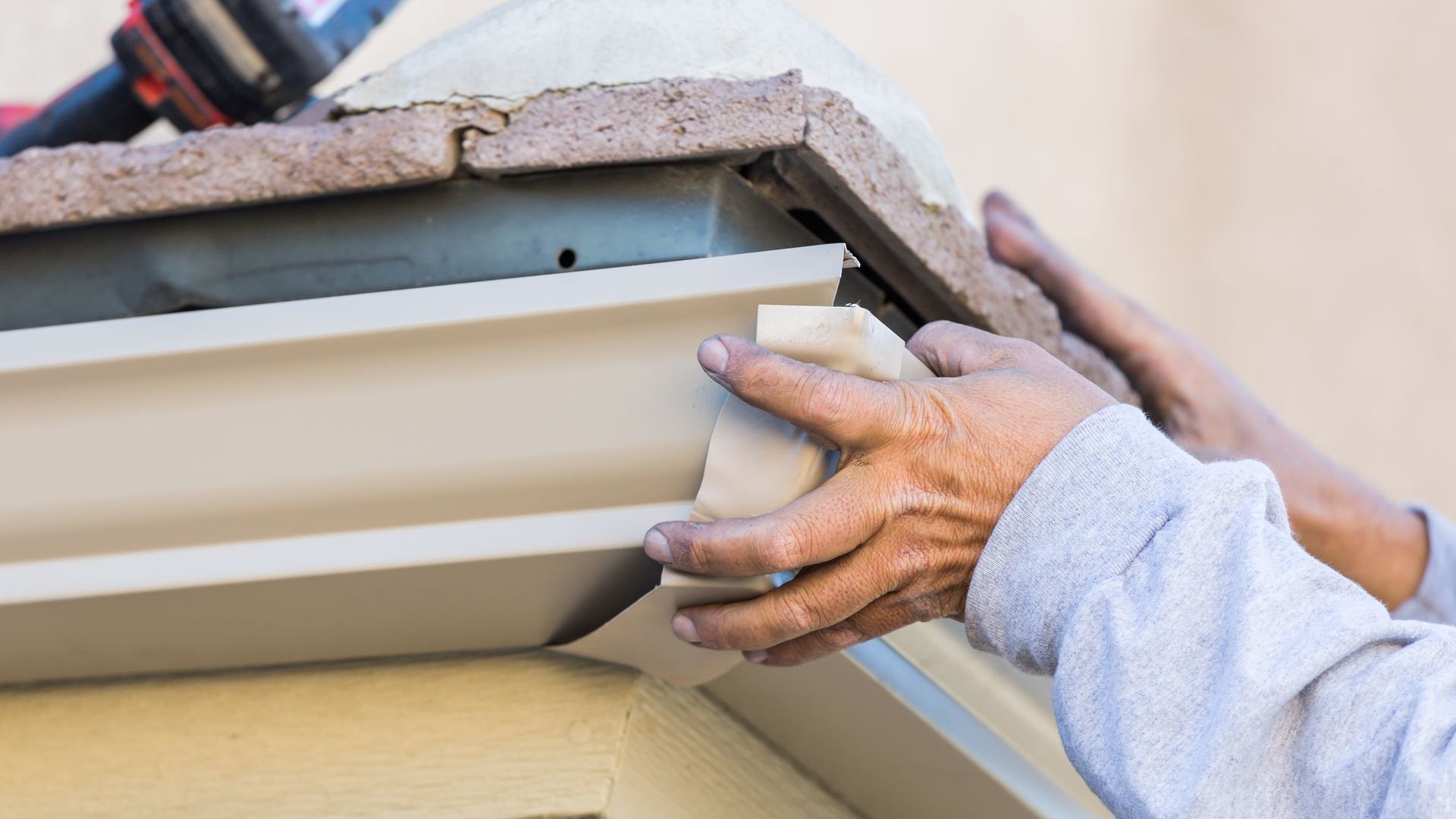 A white building with a green door and stairs.
