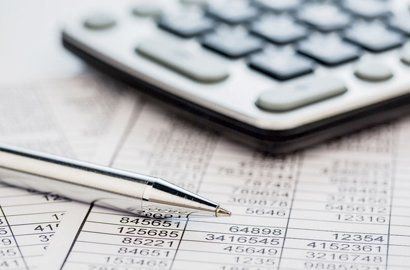 a pen and calculator for tax calculation