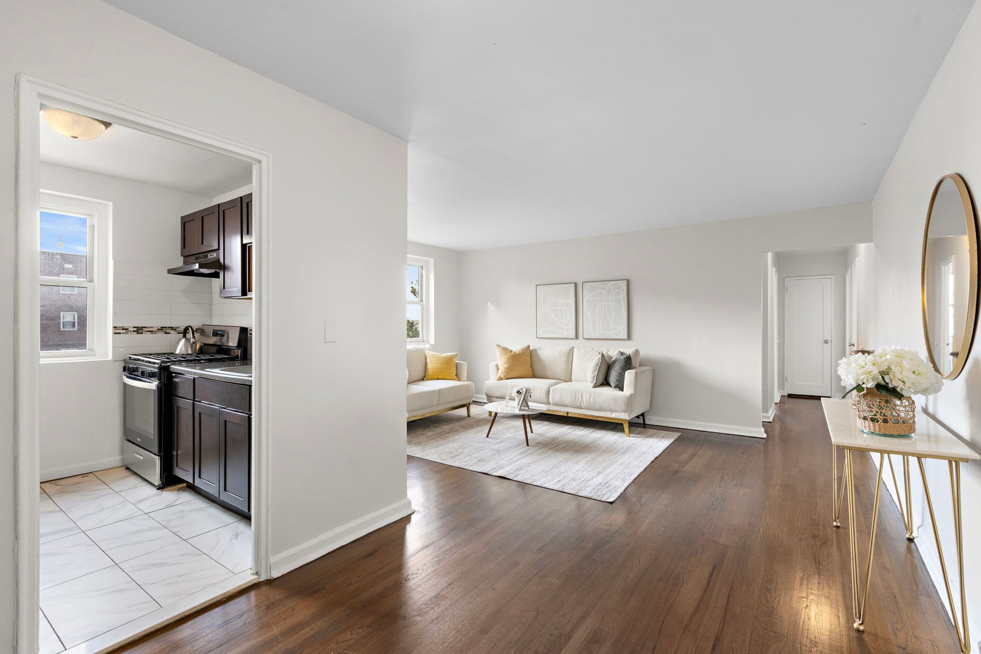 A living room with hardwood floors and a couch.