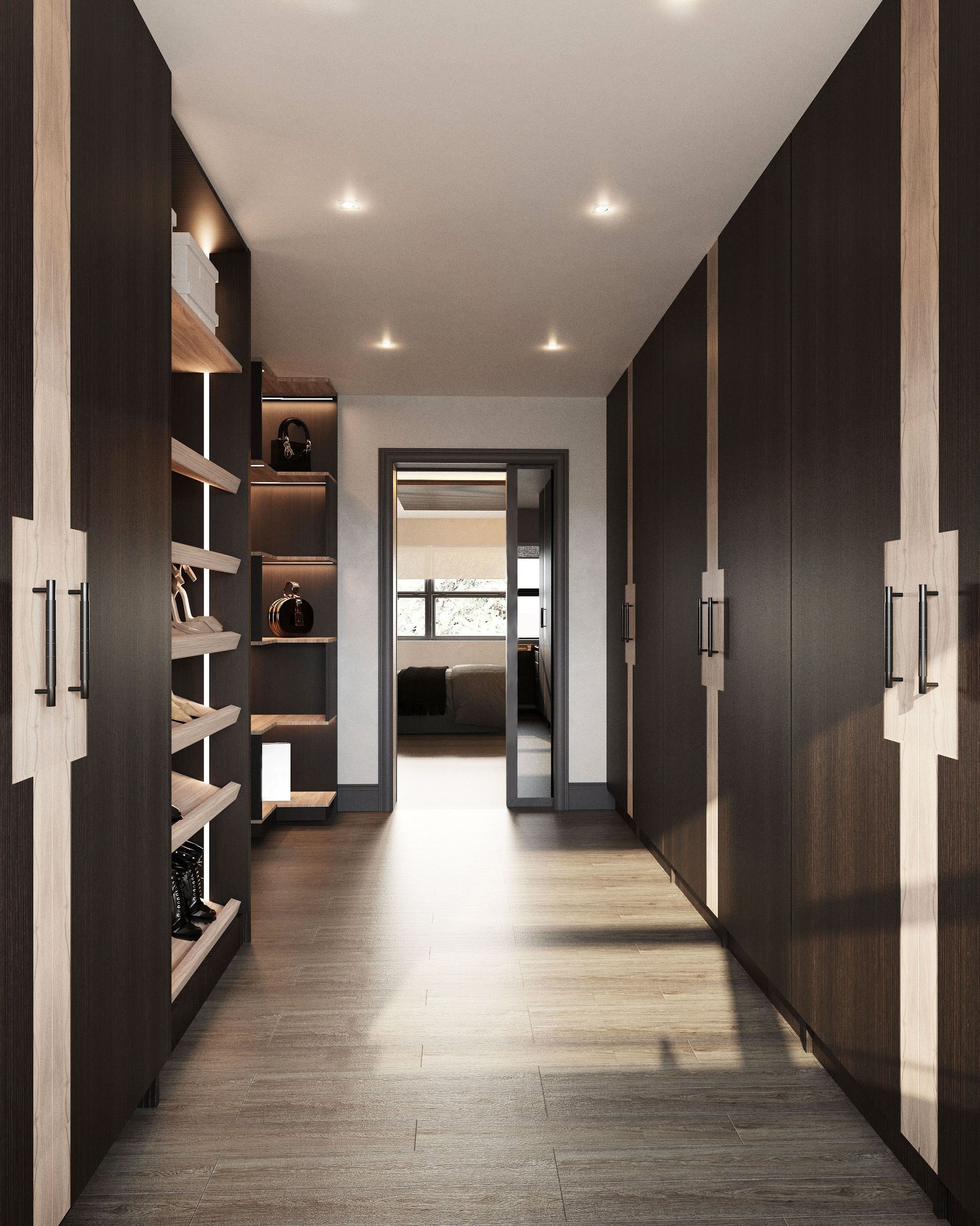 Walk‑through dressing room with dark wood wardrobes, open display shelving and view through to master bedroom