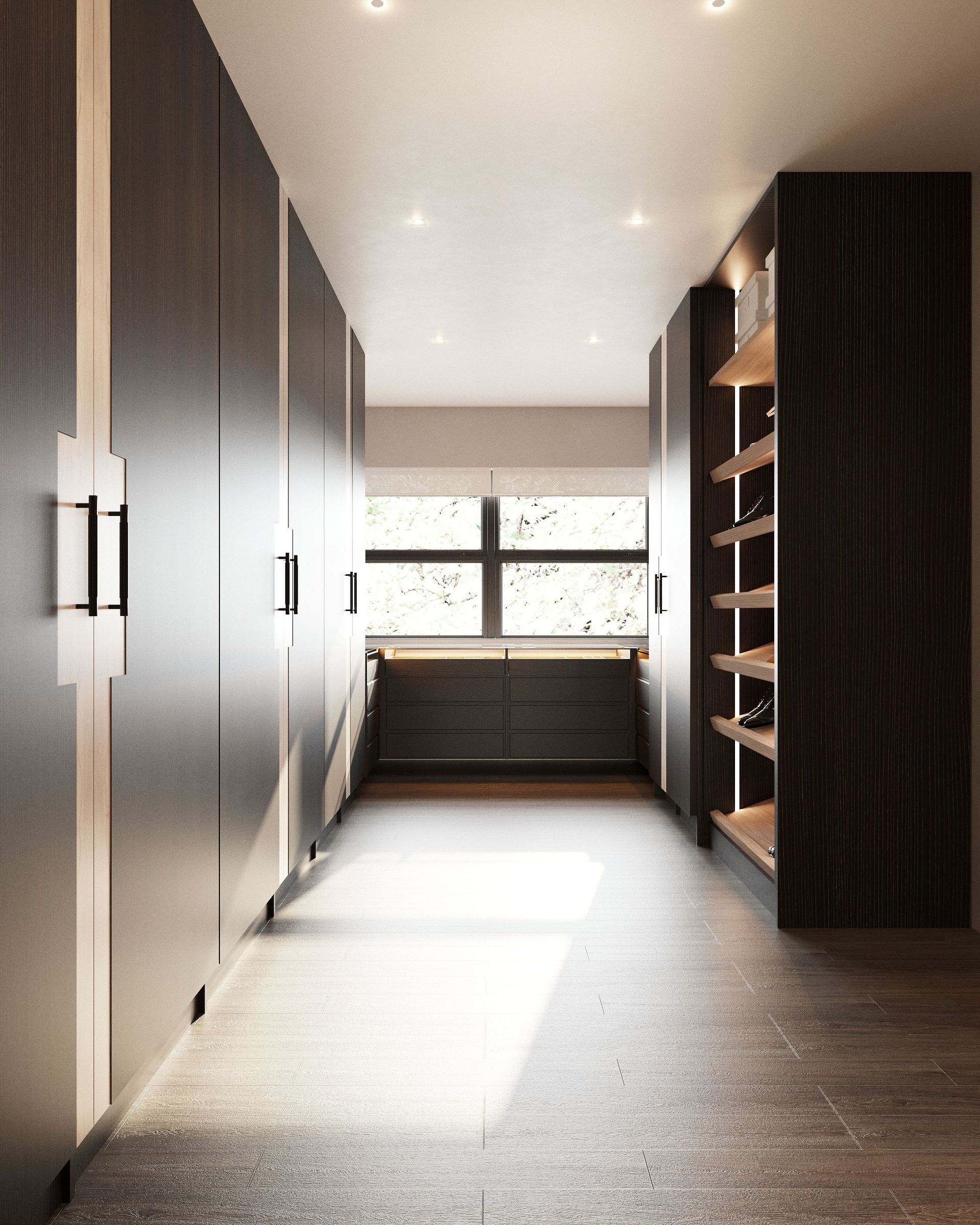 Dressing room corridor with full‑height dark wood wardrobes, open shoe shelves and window seat drawers at the end