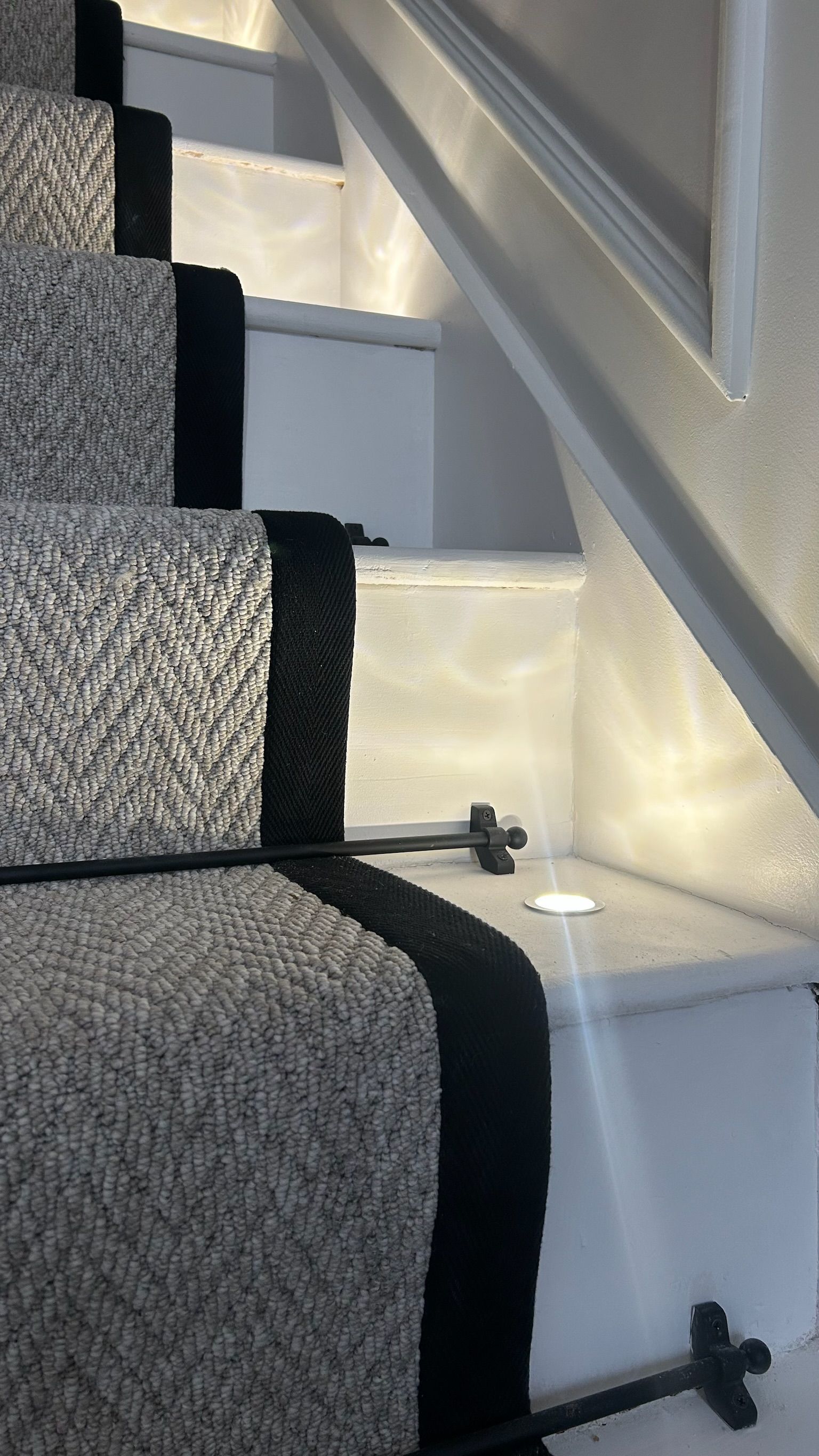 Hallway wall panelling detail with subtle LED lighting and refined finishes in luxury new build.