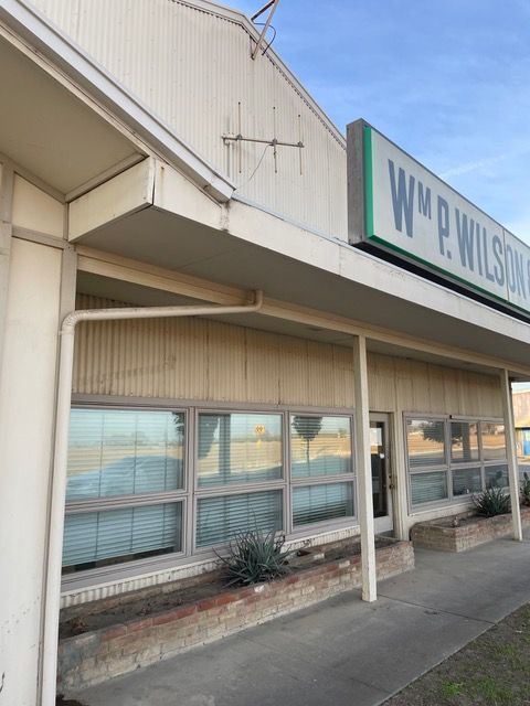 a building with a sign that says wm p wilson