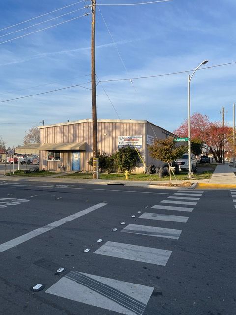a building with a sign that says ' automotive repair ' on it