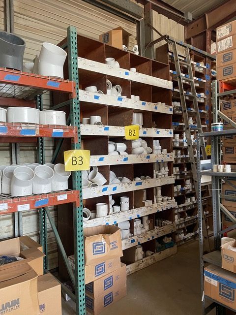 a warehouse filled with lots of pipes and boxes labeled b3 and b2