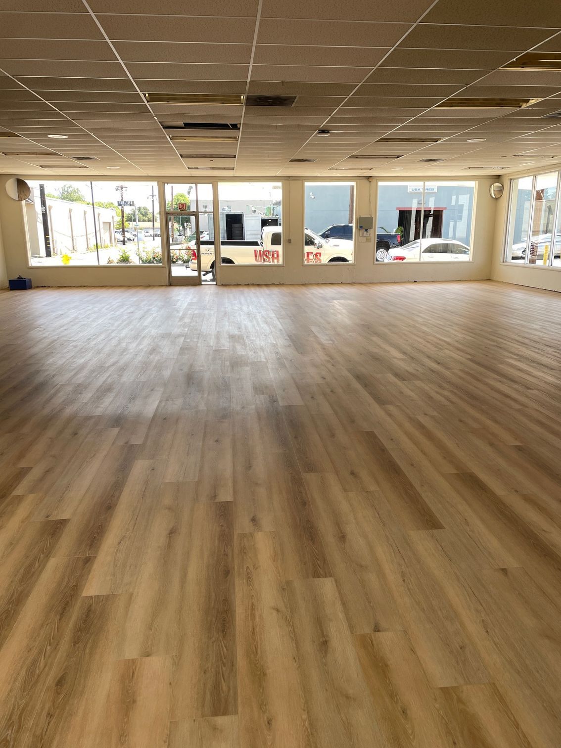 A large empty room with a wooden floor