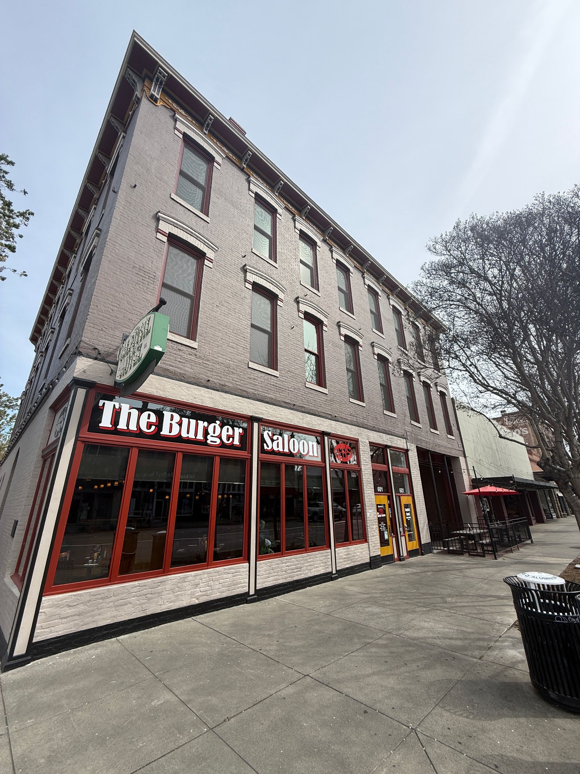 A large building with a lot of windows is called the burger saloon.