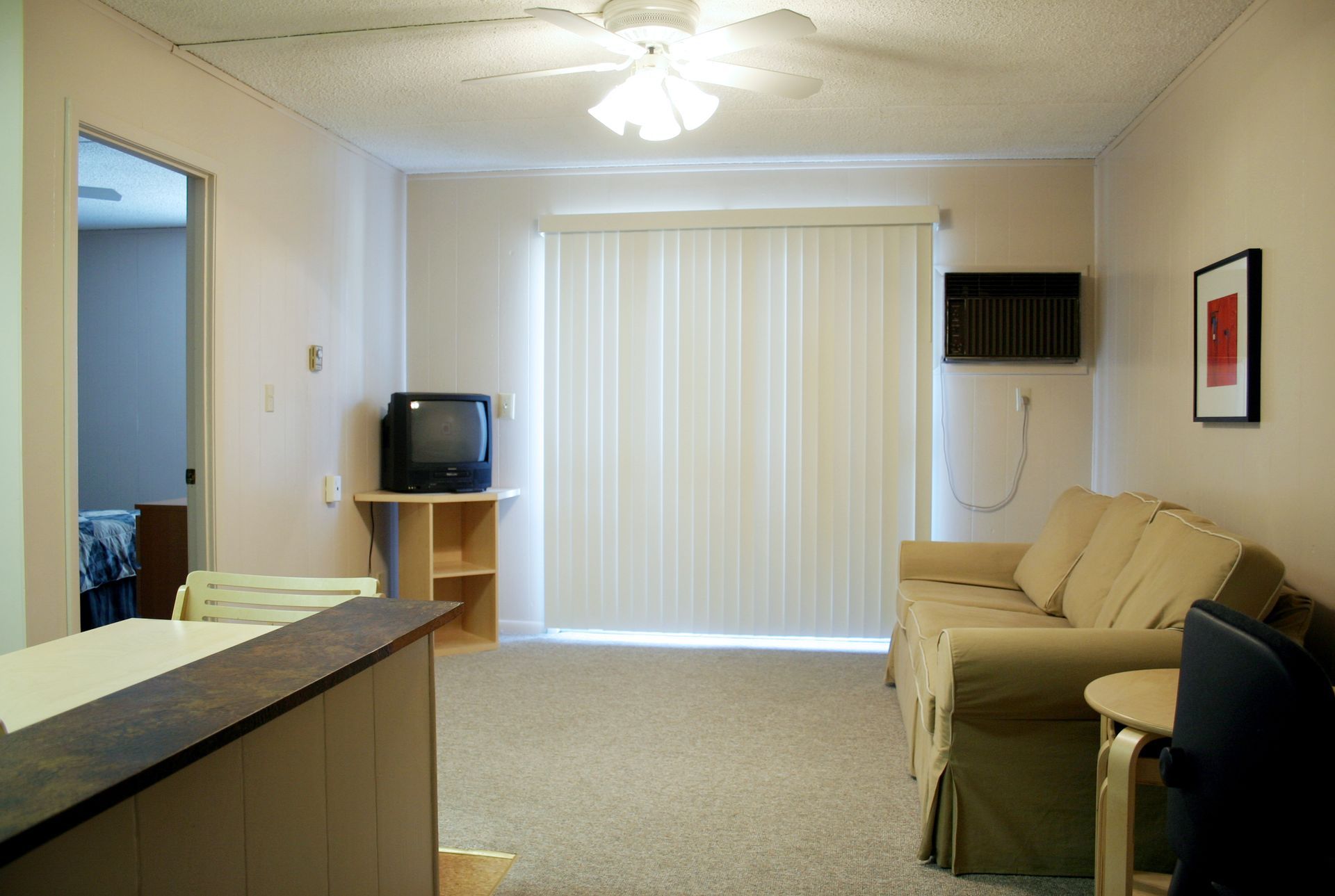 Photo showing the living room area from the front entrance point of view