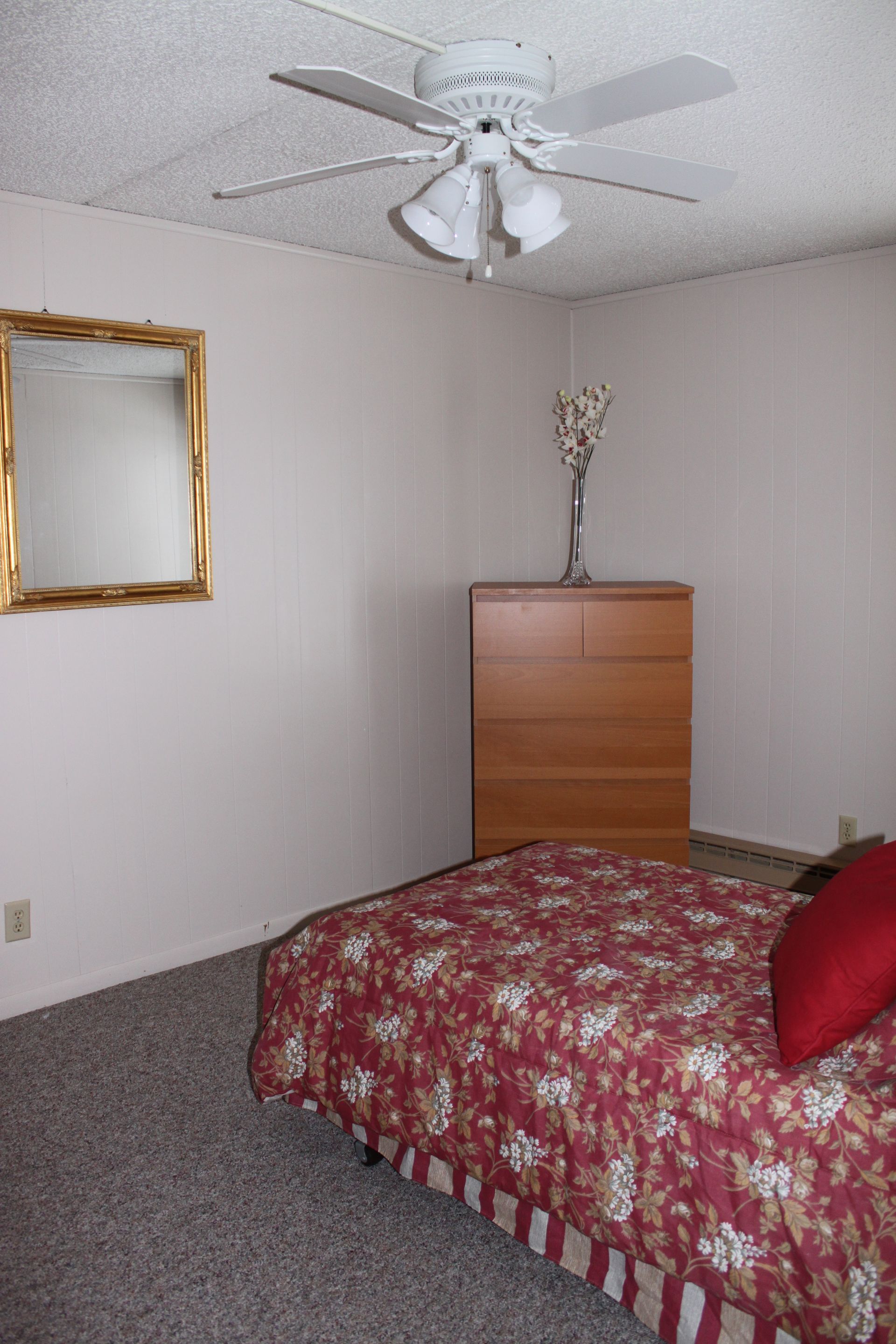 Photo showing a bedroom from an alternate angle