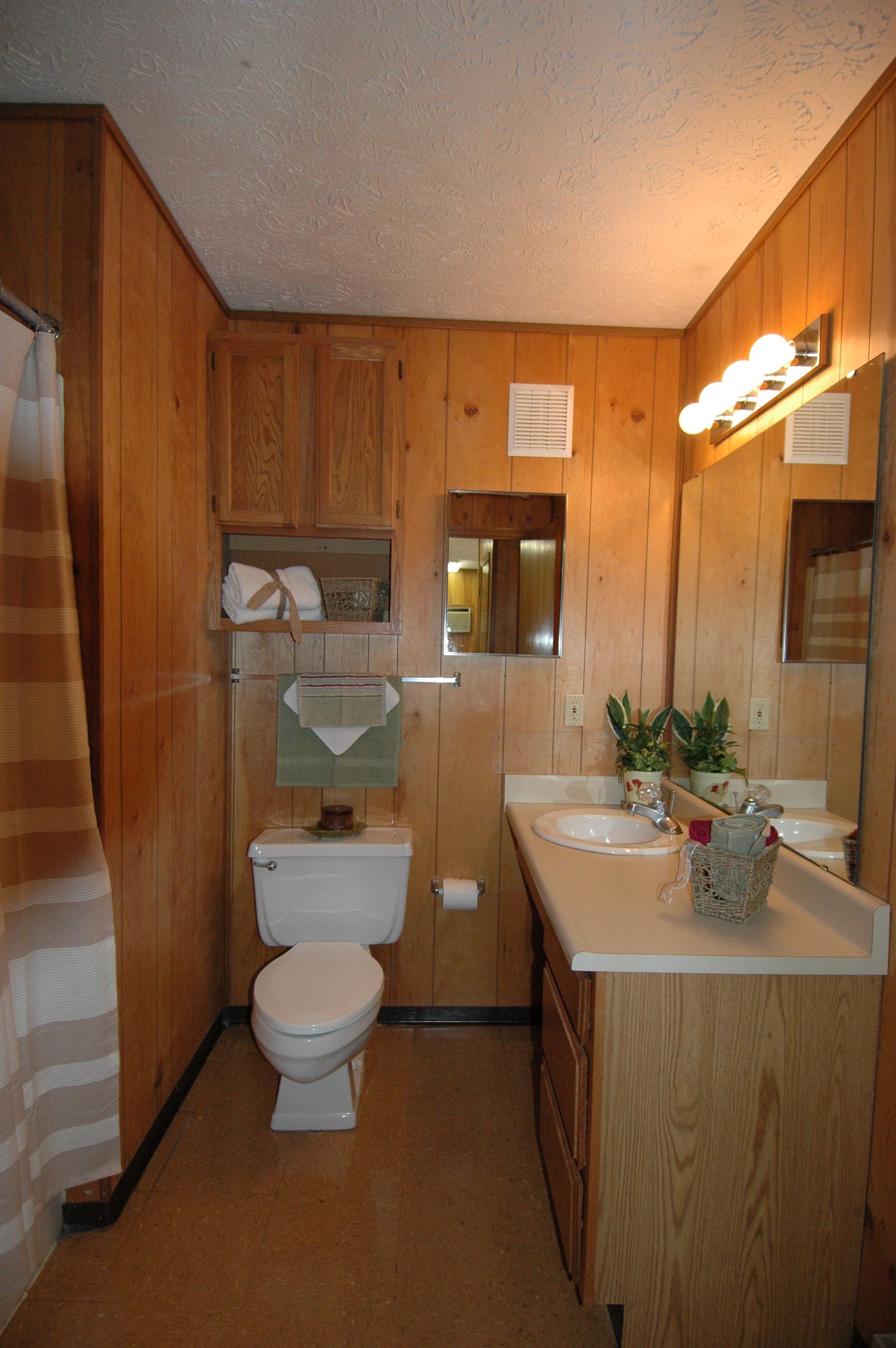 Photo showing a bathroom with a large vanity mirror