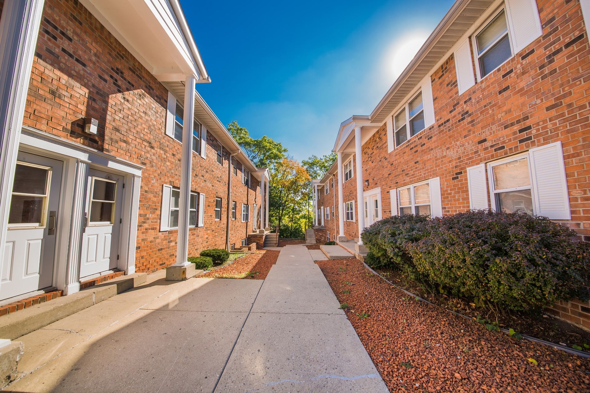 Photo showing a pair of buildings seen from the entrance area of one of the buildings