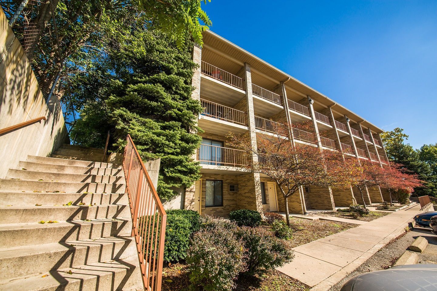Photo showing a staircase leading to the side of a 3 story building