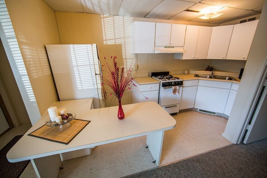 Photo showing a kitchen with a small dining area