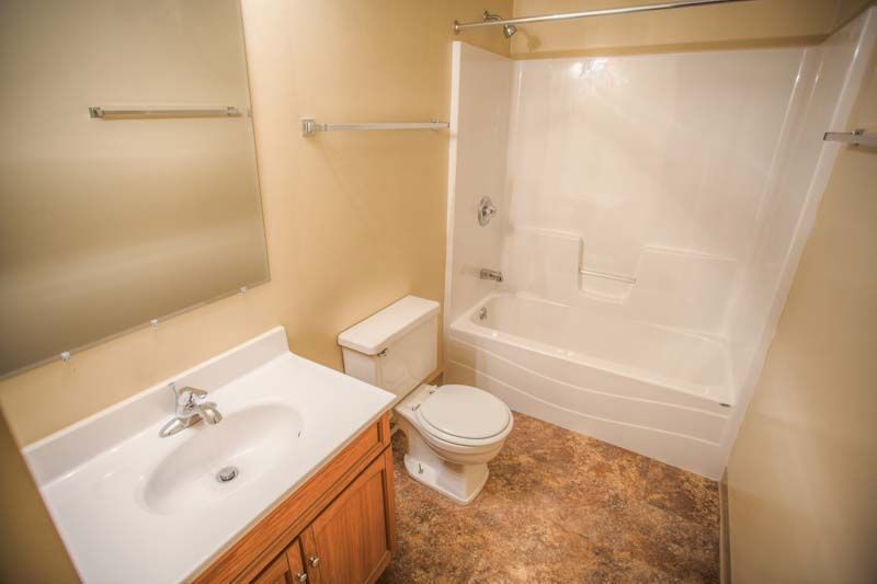 Photo showing a bathroom with kitchen/tub combo