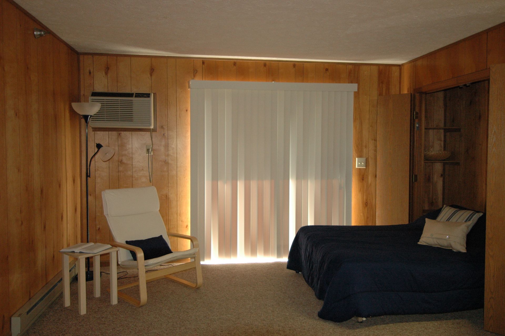Photo showing a studio's living room area with the curtains closed allowing for privacy