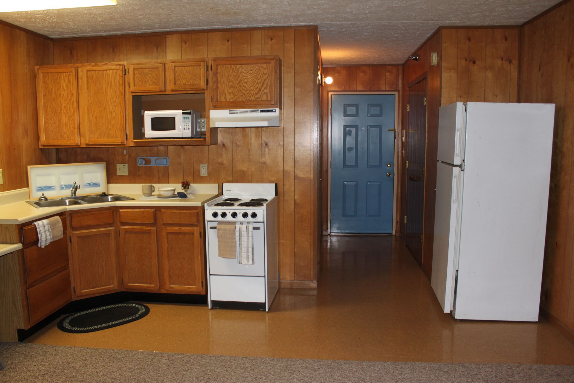 Photo showing a kitchen and a front door