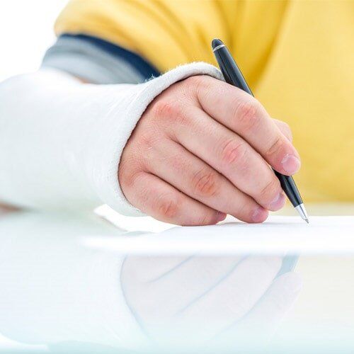 Patient signing a document - Lawyer in Milwaukie, OR