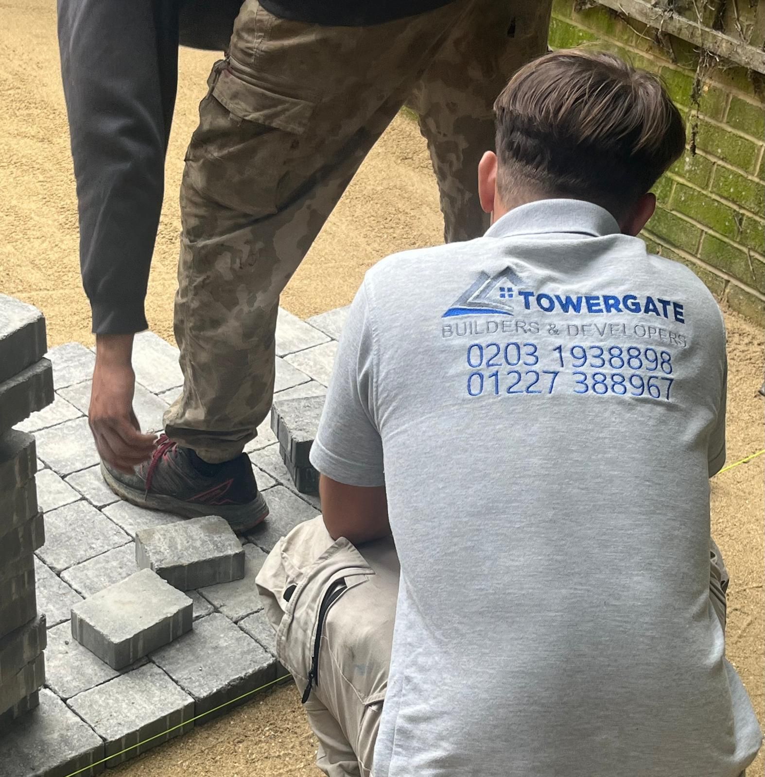 Builder laying some block paving