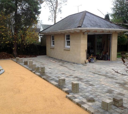 A small house with a slate roof is being built