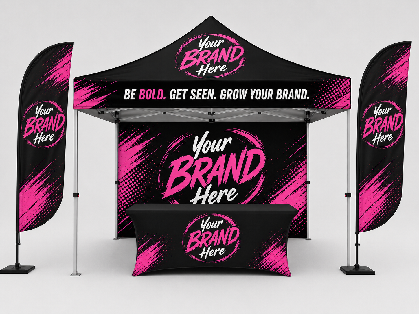 Black and pink branded event booth display with banners, table, and canopy
