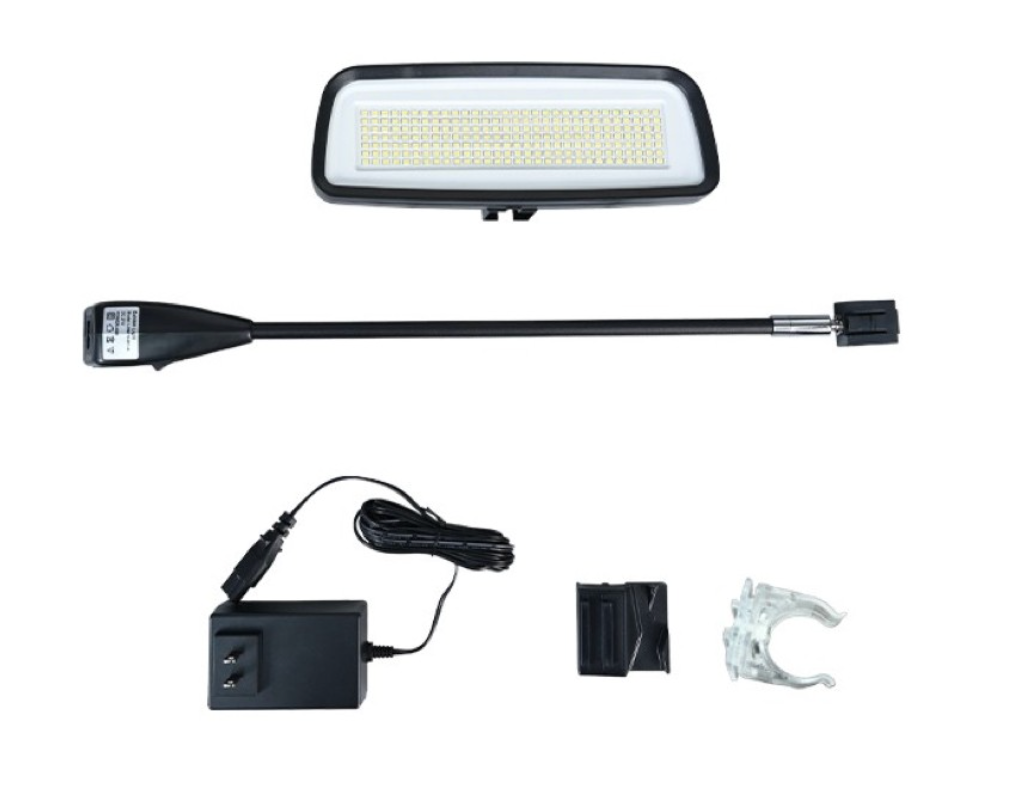 Solar-powered LED light kit with lamp, extension arm, charger, and mounting bracket on white background